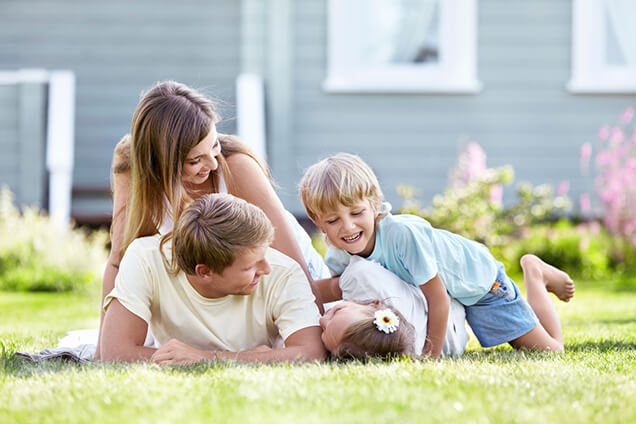 Family outside in grass